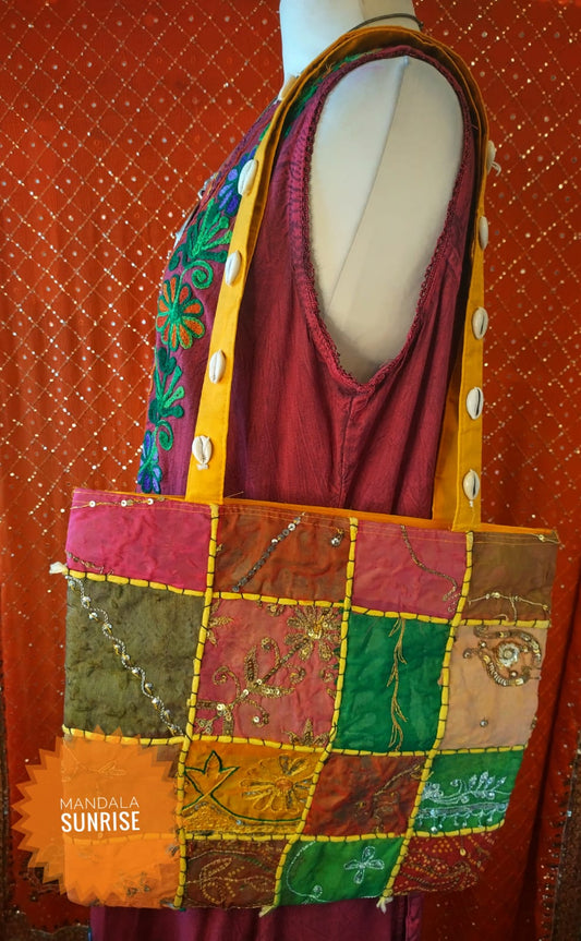 Patchwork zipped bag with features shells on straps