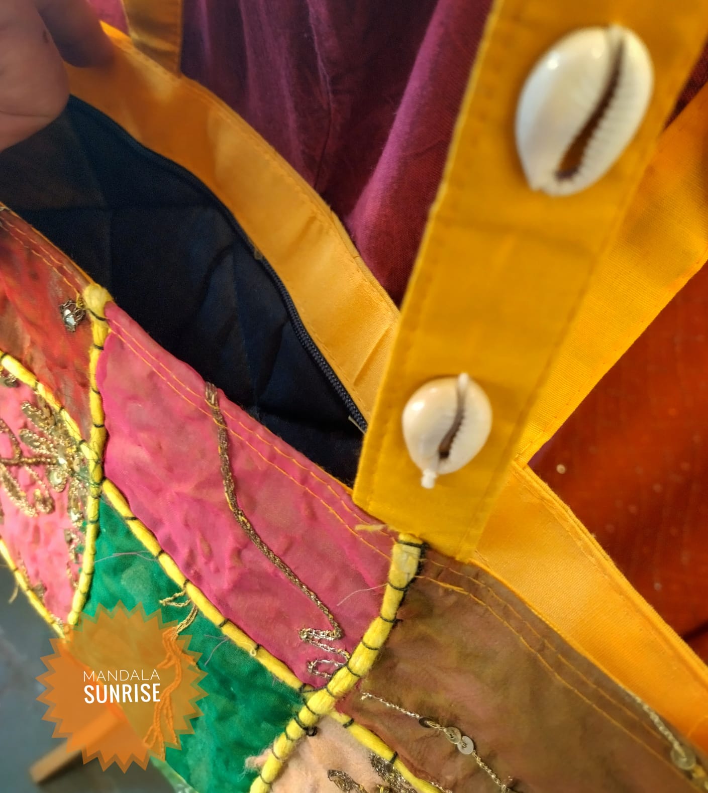 Patchwork zipped bag with features shells on straps